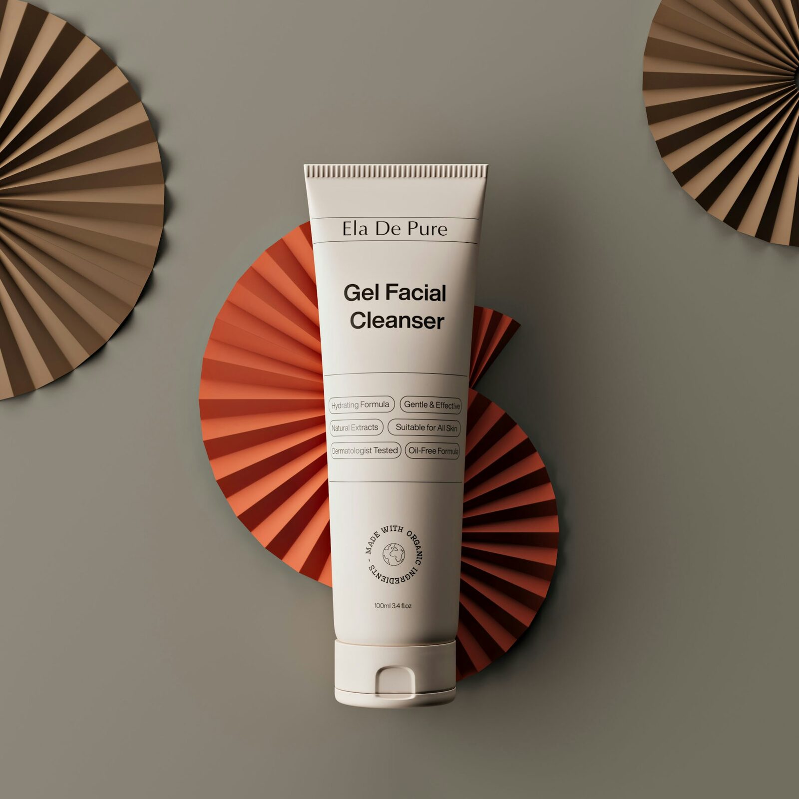 Skincare product styled with traditional folded paper fans — editorial composition referencing Japanese aesthetic heritage.